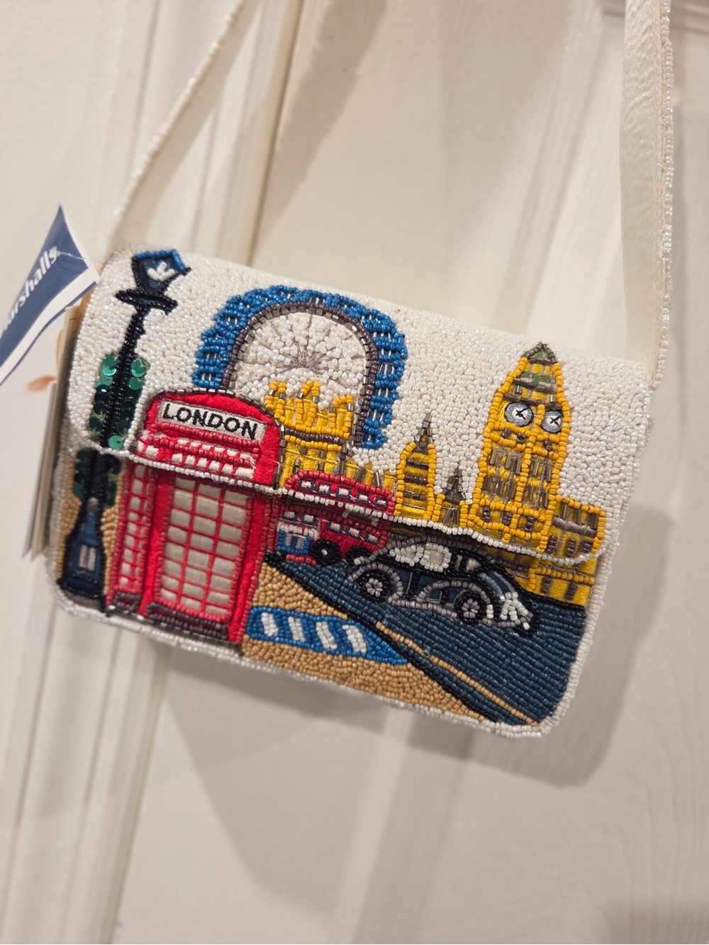 London beaded purse with red telephone booth, blue arch, and yellow buildings #l